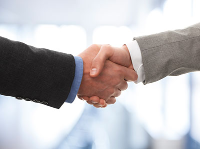 image of men shaking hands